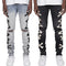 Męskie jeansy skinny fit z przetarciami i graficznymi nadrukami