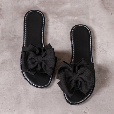 Letnie kapcie damskie - Lekkie płaskie sandały z kokardką