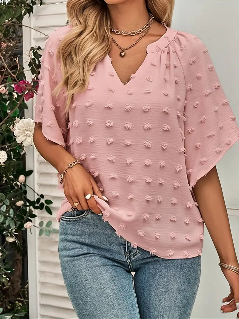 Elegancki i szykowny top z dekoltem w serek w szwajcarskie kropki
