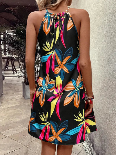 Zomerse Zwarte Jurk met Tropische Bladeren Mouwloos & ElegantLetnia czarna sukienka z tropikalnymi liśćmi bez rękawów i elegancka