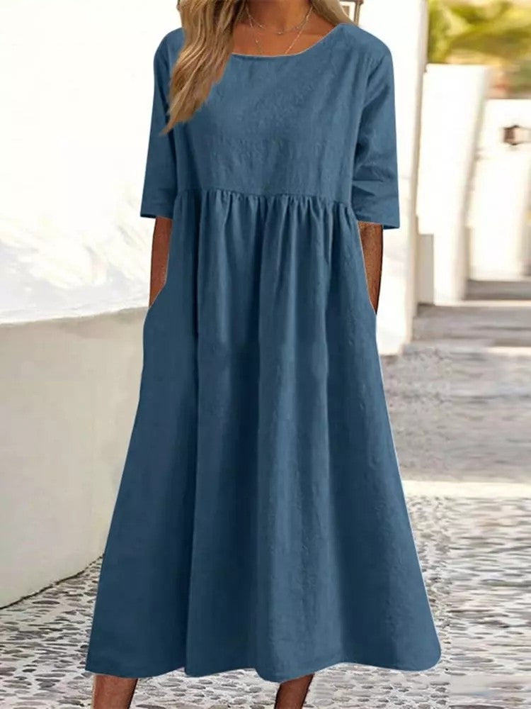 Silvia™ - Elegancka bawełniana sukienka z okrągłym dekoltem i wygodnymi kieszeniami